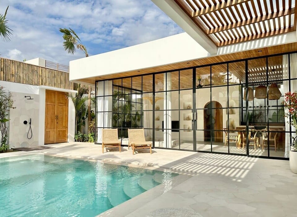 Outdoor area with swimming pool, daybeds, and a lounge