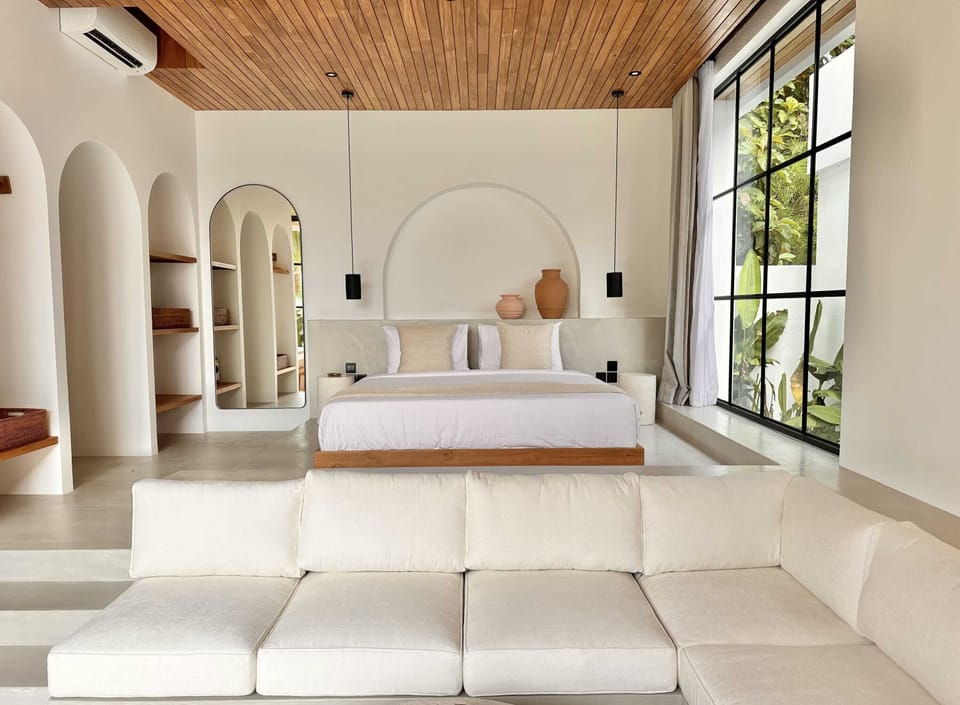 A king size bed with a garden view