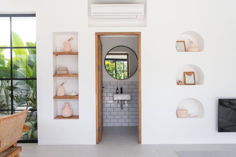 Entrance to the guest toilet and a laundry room