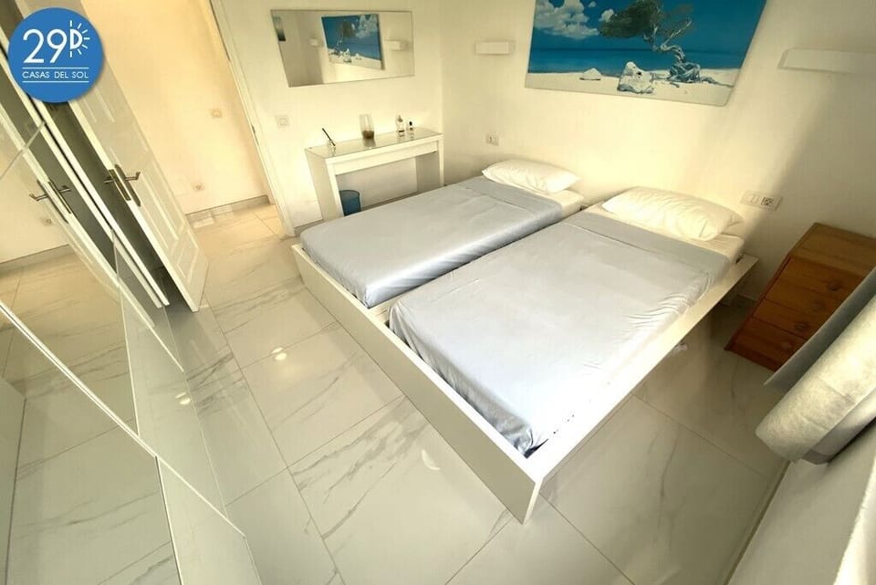 Main bedroom, built in wardrobe, dresser and mirror.