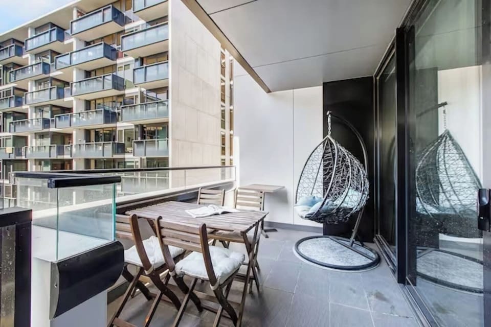 The spacious balcony is furnished with a four-seater setting and a cosy hanging pod chair where you can enjoy your morning coffee or an afternoon glass of wine. 
