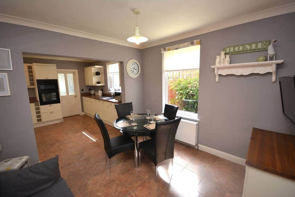 Fully equipped open kitchen with an additional dining area.