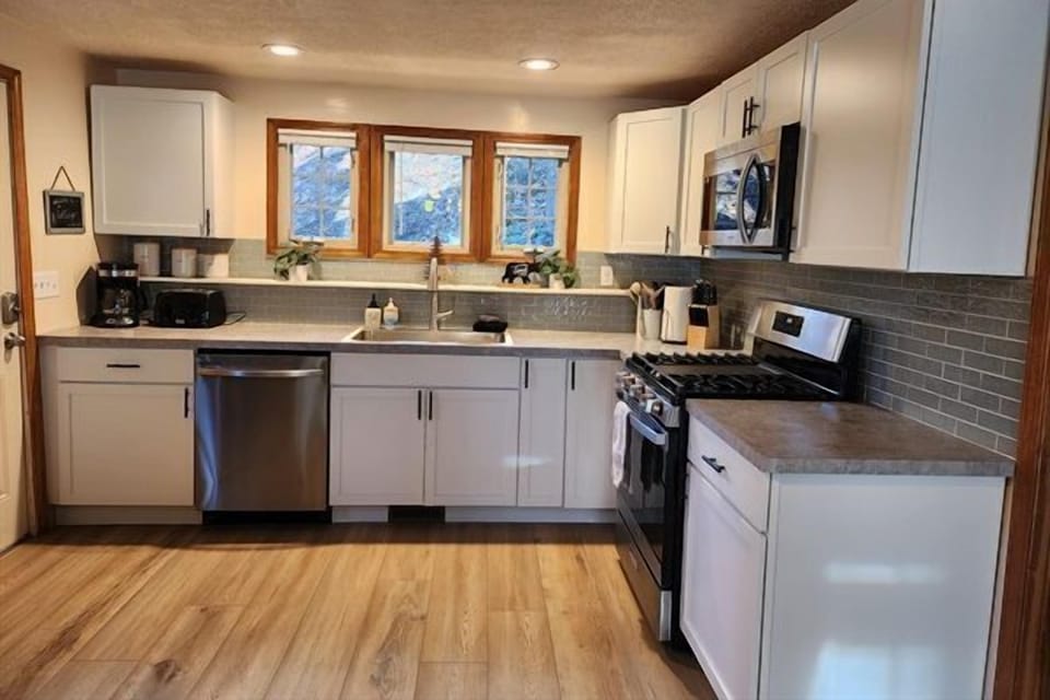 Kitchen with stainless steel appliances.