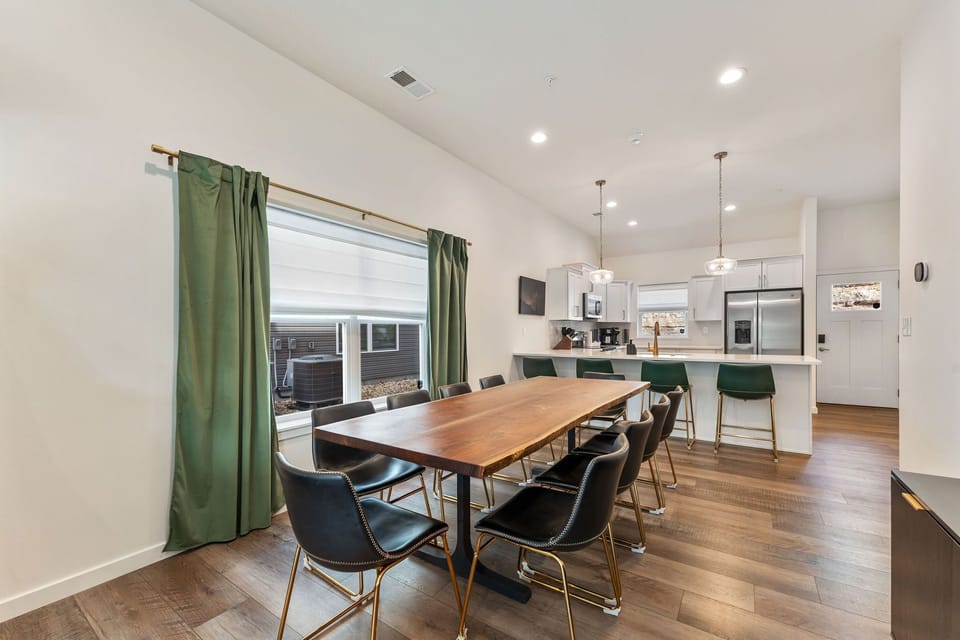 Gather for meals, card games, and conversation around this beautiful custom dining table with lake views.
