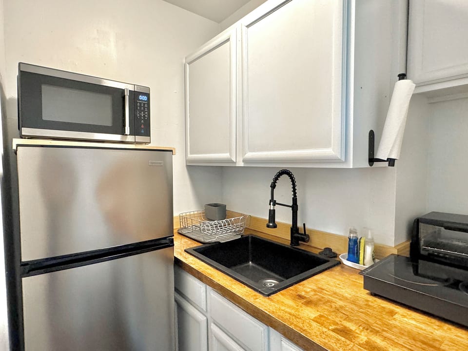 The kitchen provides a well-equipped, stylish space for whipping up meals and snacks