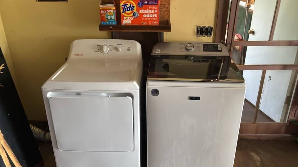Shared washer and dryer — detergent provided.