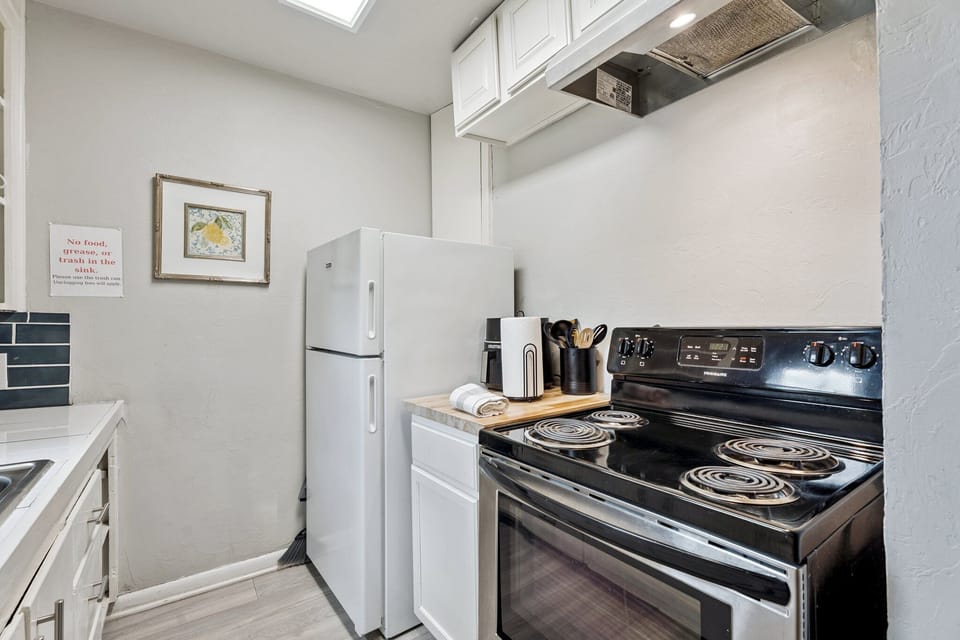 Everything you need at your fingertips, including a full-size fridge, oven, coffee station, and plenty of counter space.