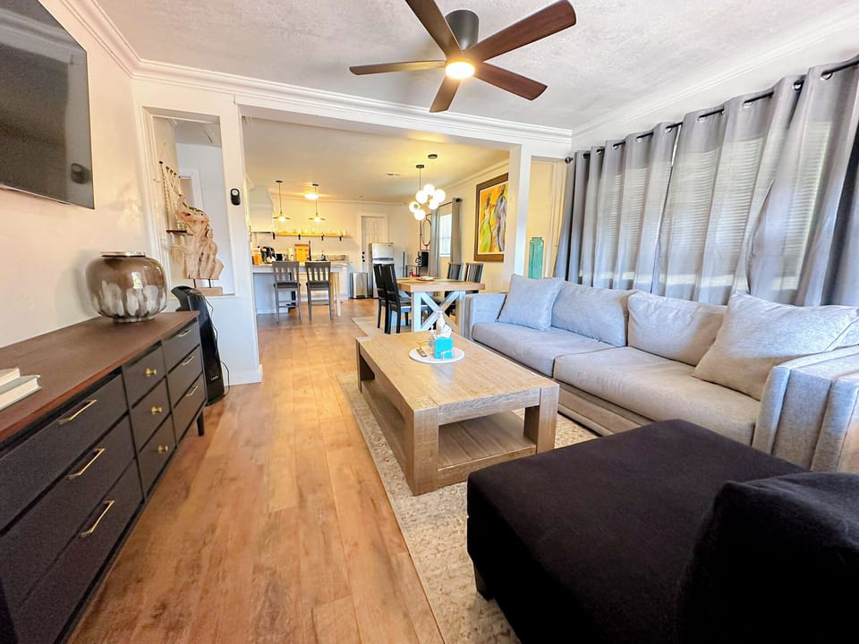 The living room exudes warmth and comfort, inviting you to sink into cozy seating.