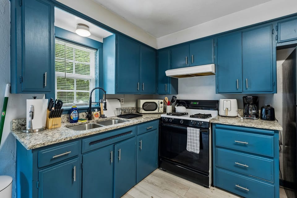 Bright blue cabinetry brings a fresh, cheerful touch to the kitchen.