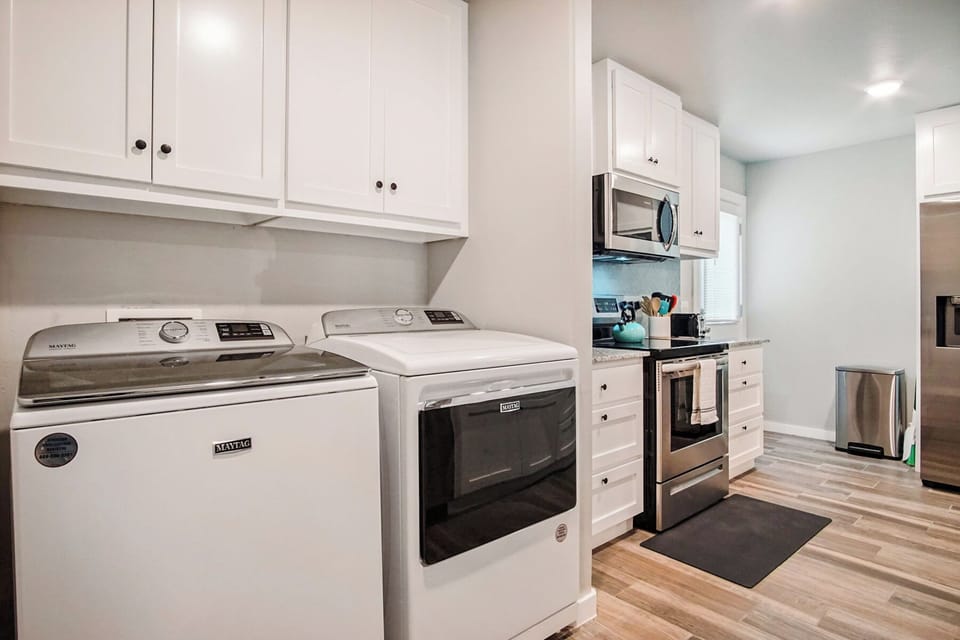 Cook in a sleek kitchen designed for both function and beauty.
