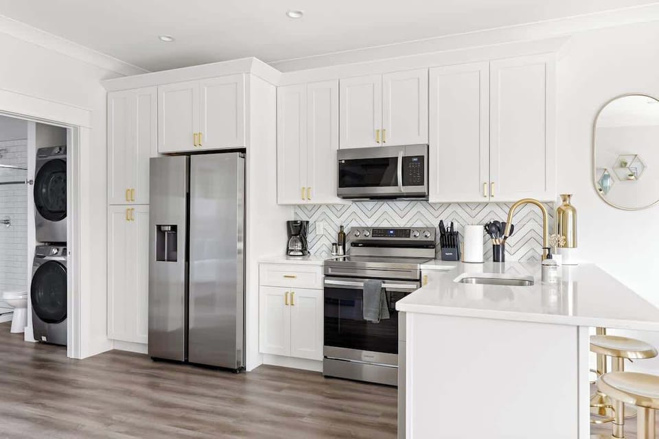Full kitchen with dishwasher, toaster, blender, mixer, dinnerware, and pots/pans/cooking utensils
