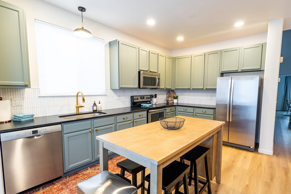 Stainless steel appliances and granite countertops.