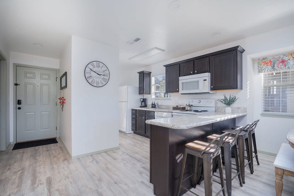 Whip up a delicious meal in the fully equipped kitchen - the heart of your cozy condo that's sure to inspire your inner chef!