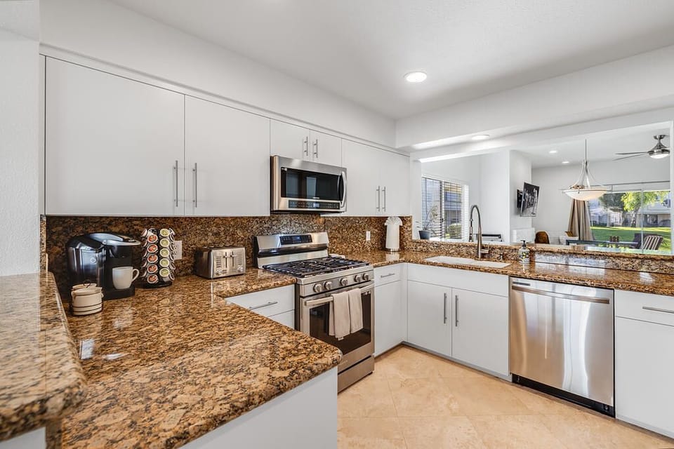 Bright, well-appointed kitchen w/new appliances and soft-close cabinetry.