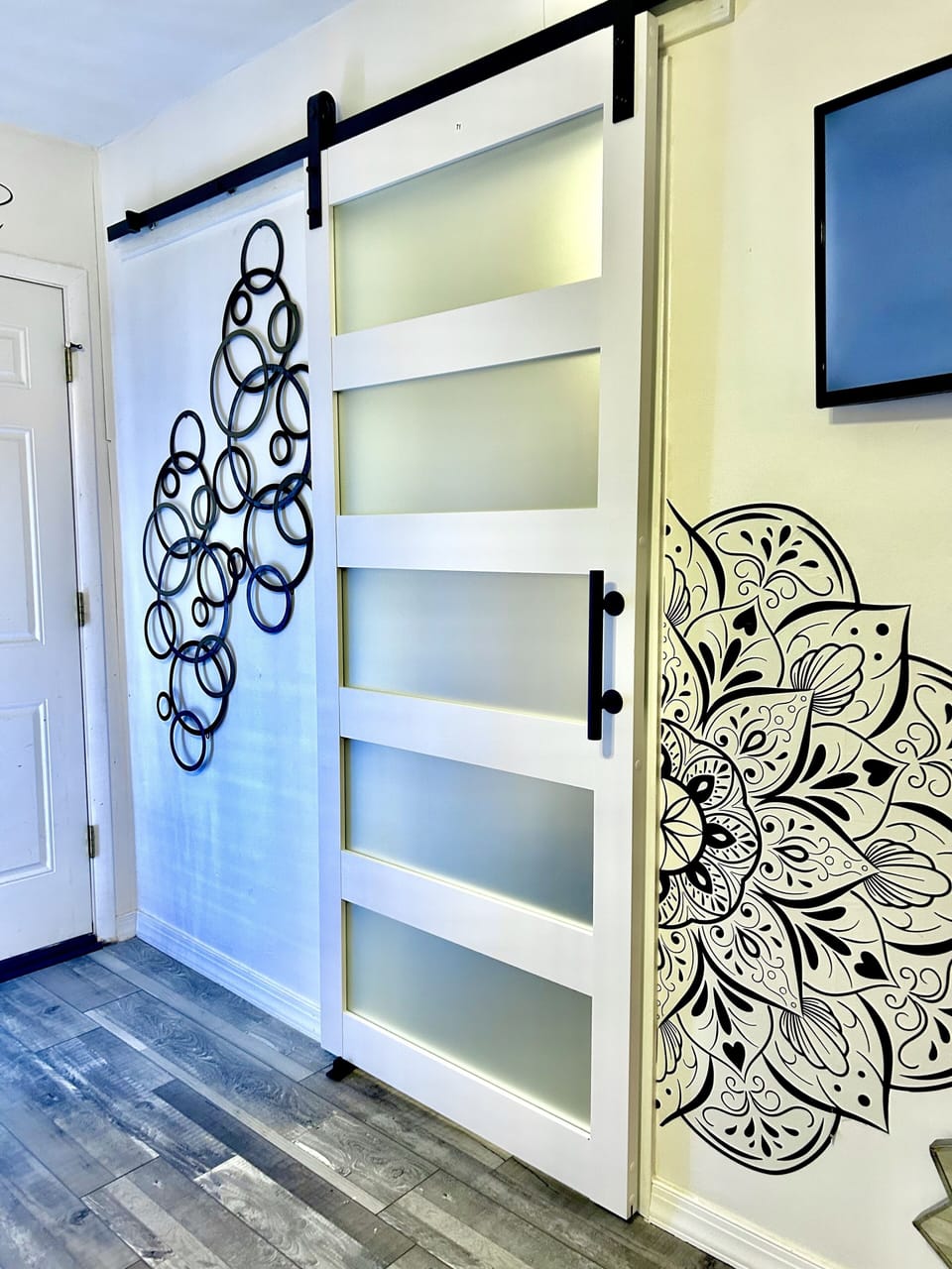 Barn door separates bedroom 1 and bedroom 2. Door can be closed from either side