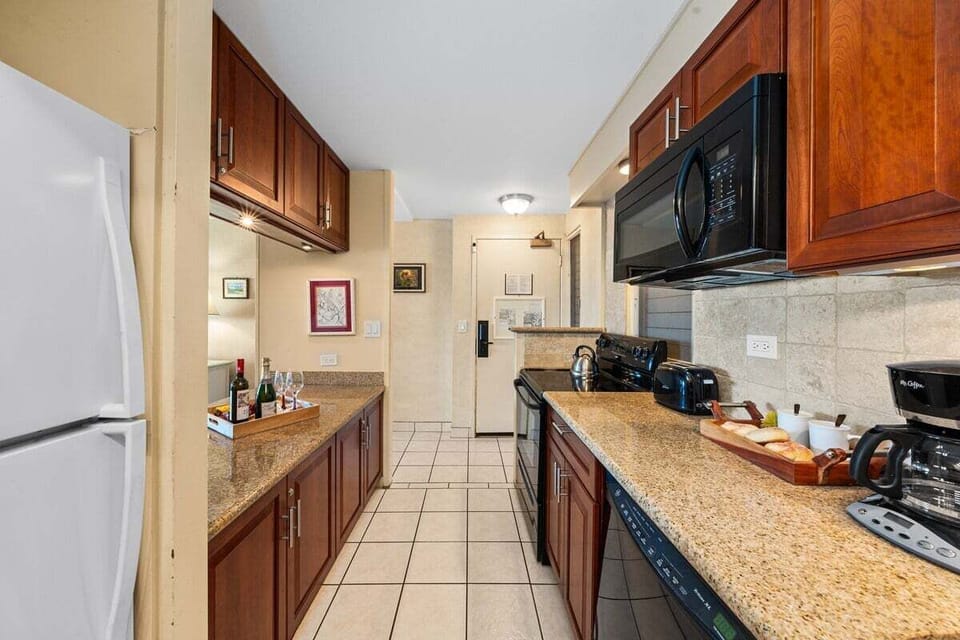 Spacious galley kitchen with granite counters and plenty of storage