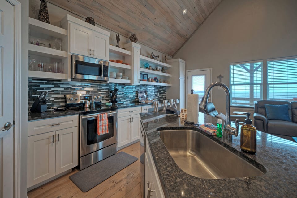 The fully equipped kitchen features high-end appliances.