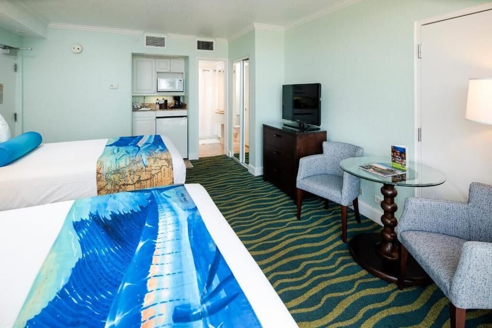 Settle in with a cozy sitting area and in-room TV.
