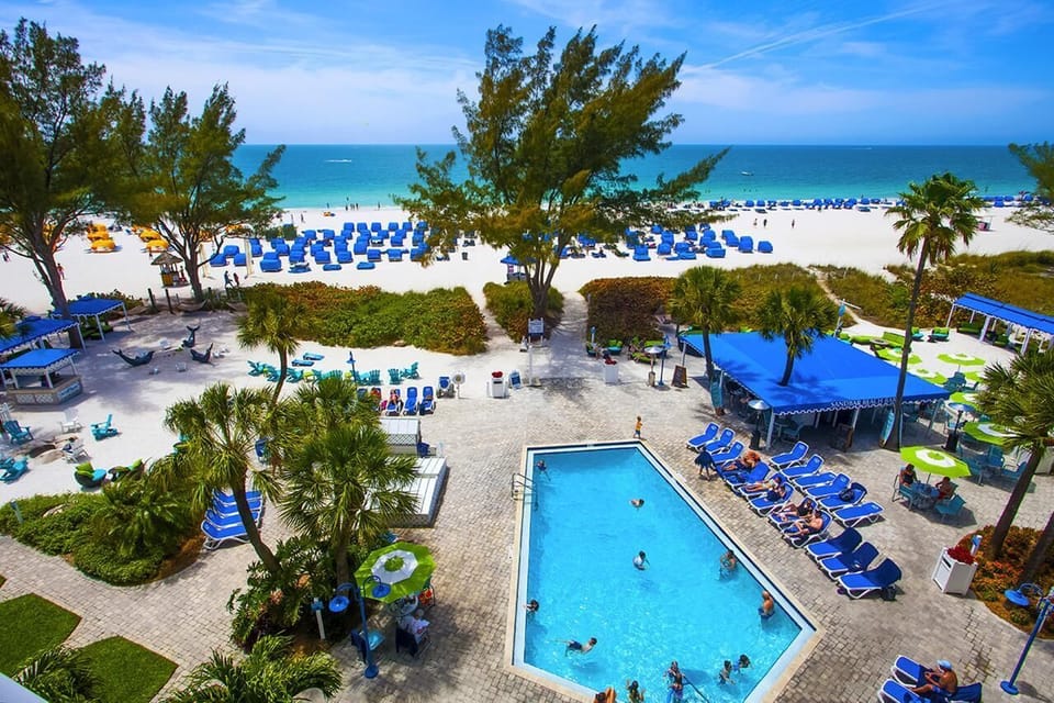 Soak up sunshine with poolside lounging steps from sand.