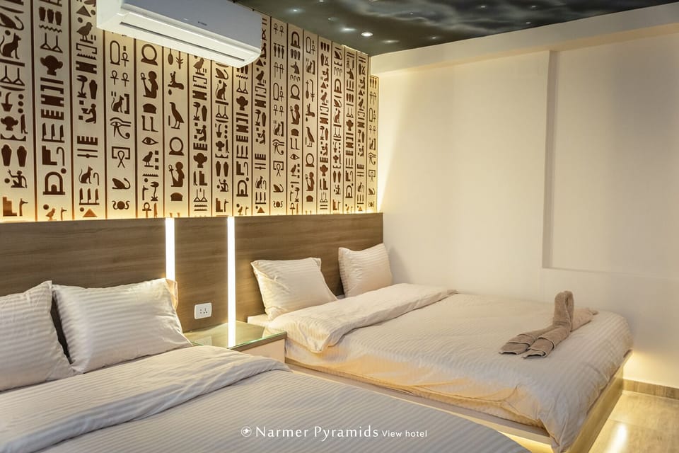 Bed wibackboards carved with ancient Egyptian hieroglyphic symbols light up