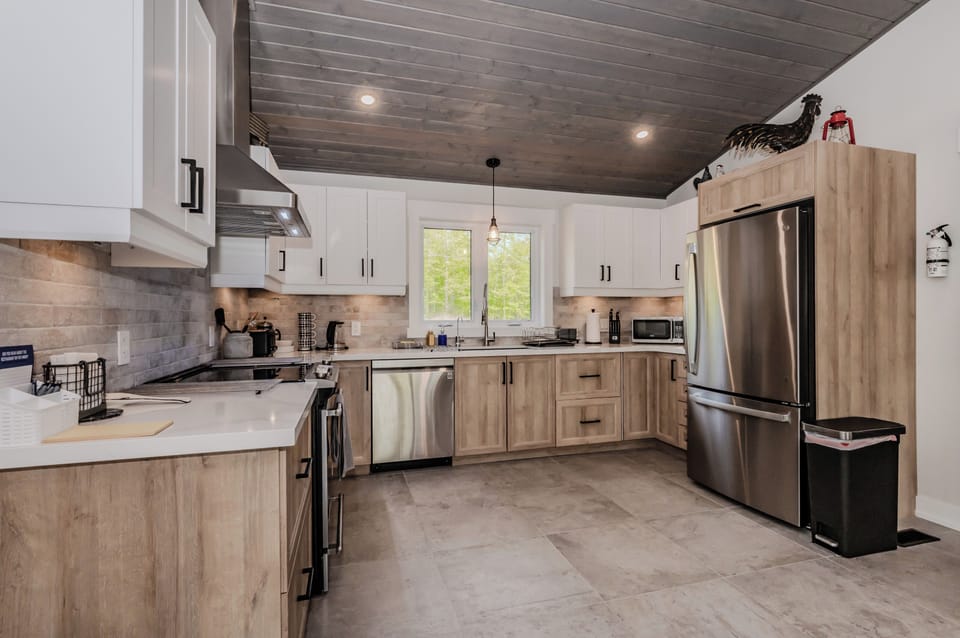 The kitchen at the Orchid Retreat is a chef's dream, featuring modern appliances, and ample counter space. It's designed to be both functional and aesthetically pleasing!
