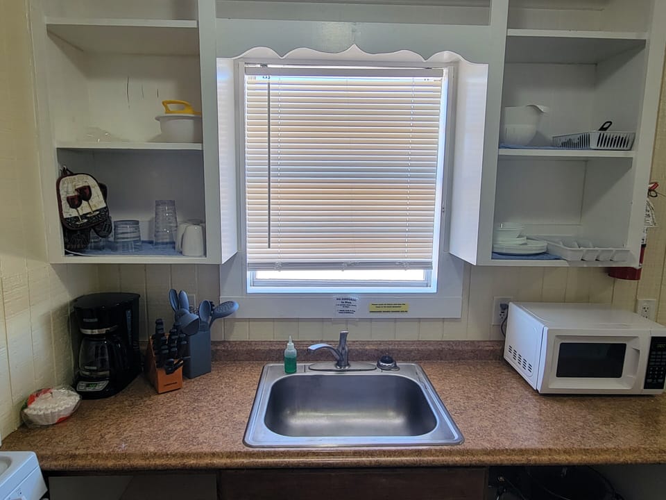 Kitchen basics, soaps, and paper products are provided.