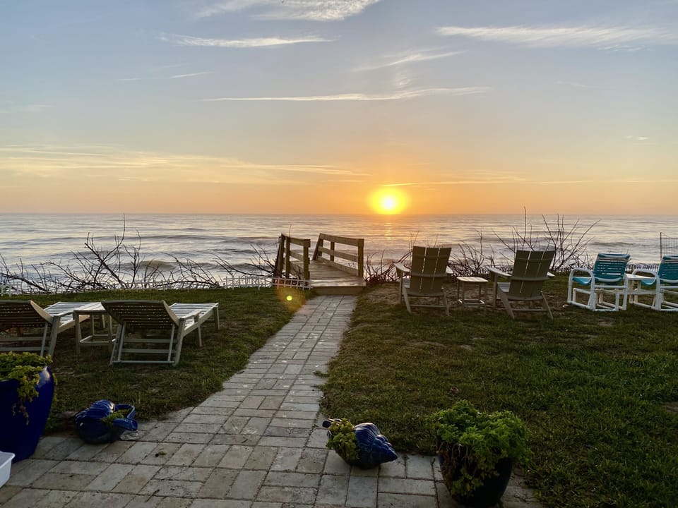 The back yard and beach with another gorgeous sunrise.
