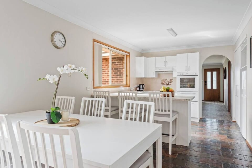 Dining area with indoor table and working fireplace.