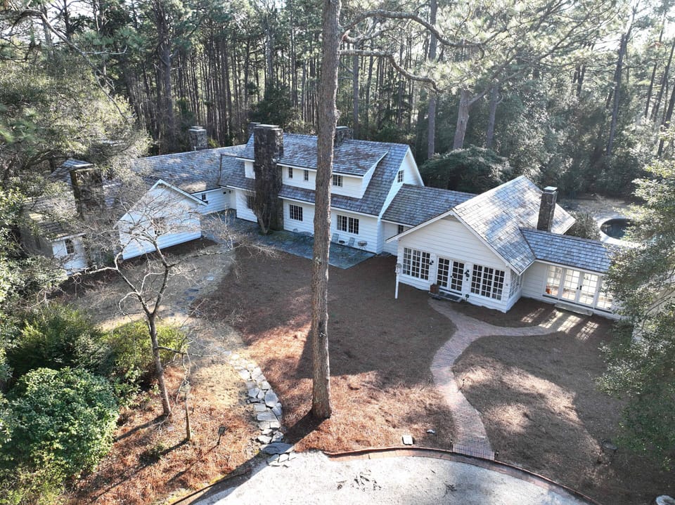 Enter the house through the kitchen door via walking path attached to the d-way