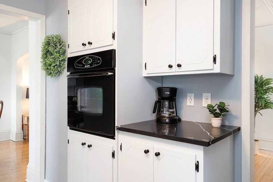 Waist height built-in oven and coffee bar. 