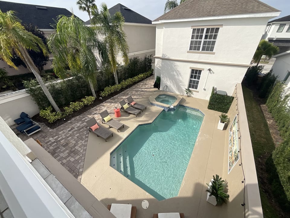 View from bedroom balcony overlooking private pool