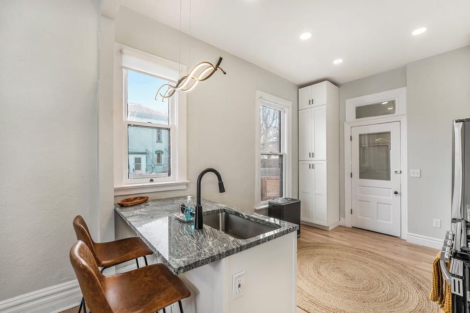 Sip in style at our wet bar, complete with a sink and two trendy bar stools.