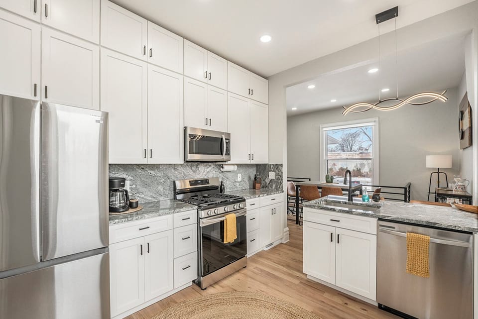 Discover the beauty of our kitchen, complete with sleek stainless steel appliances.