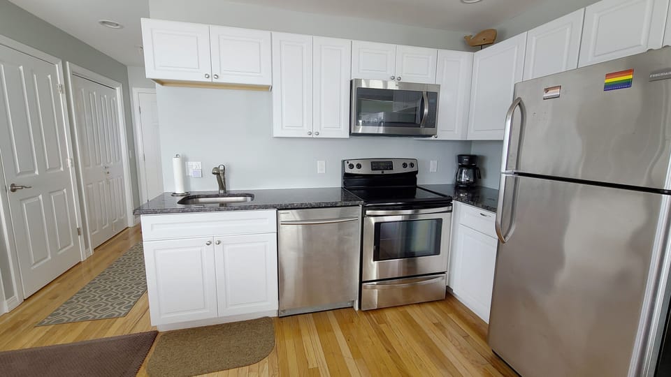 Nicely equipped kitchen with stainless appliances