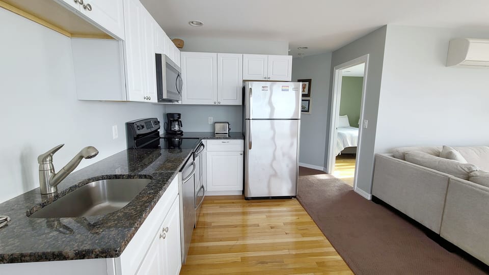 Nicely equipped kitchen with stainless appliances