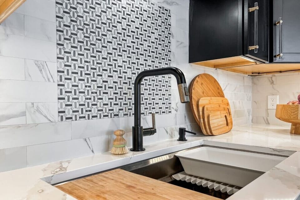 "Enjoy the elegant design of our beautifully appointed kitchen sink area."

