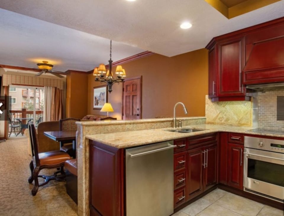 Kitchen and dining area; washer and dryer adjacent to kitchen. 