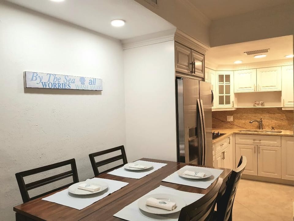 Kitchen and dining area of 1 bed/ 1.5 bath unit