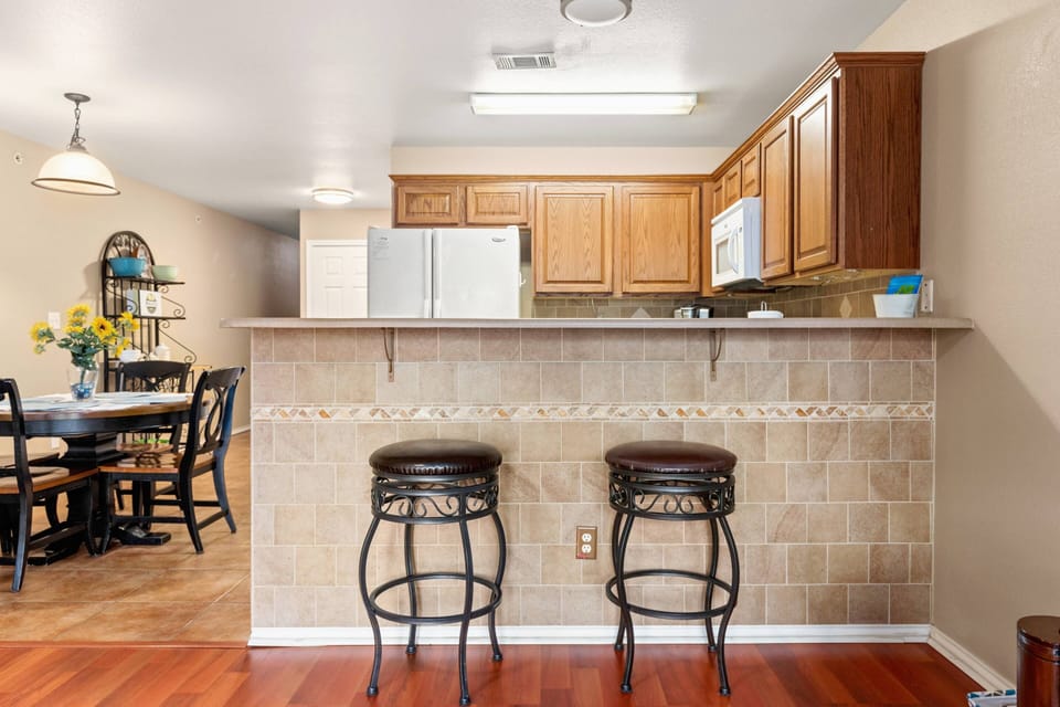 Additional barstool seating that invites you to savor your morning coffee or engage in lively conversation.