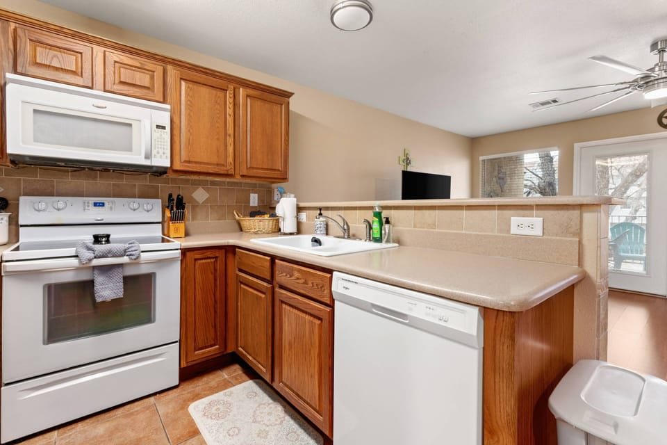 The kitchen opens into the welcoming living room, creating an atmosphere perfect for togetherness.