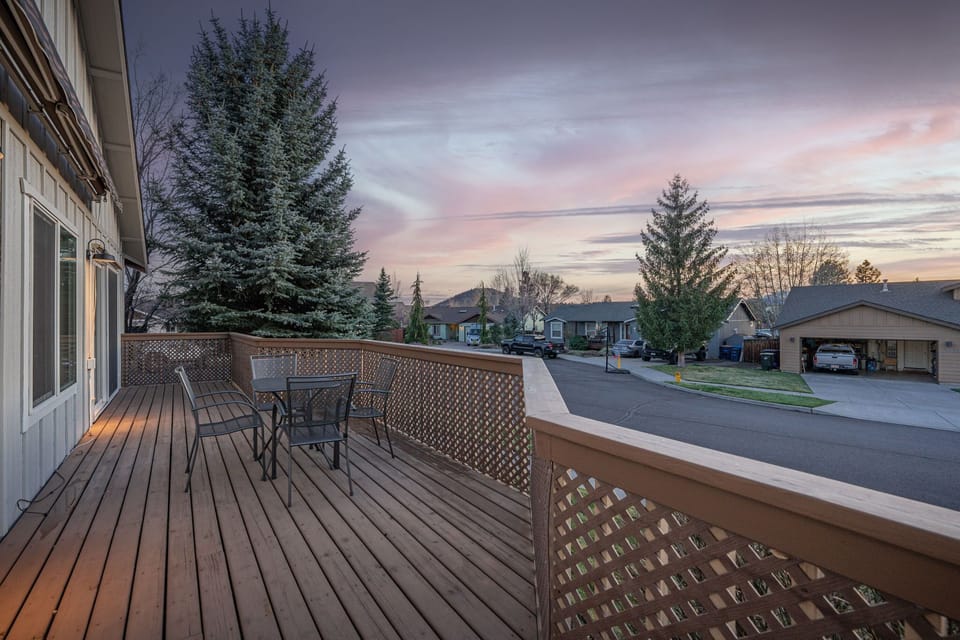 Spacious private deck with seating and beautiful sunset views