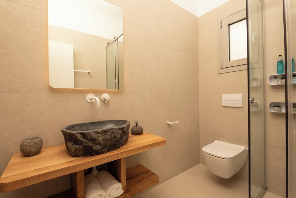 Step into our rejuvenating bathroom, where modern design meets functionality.