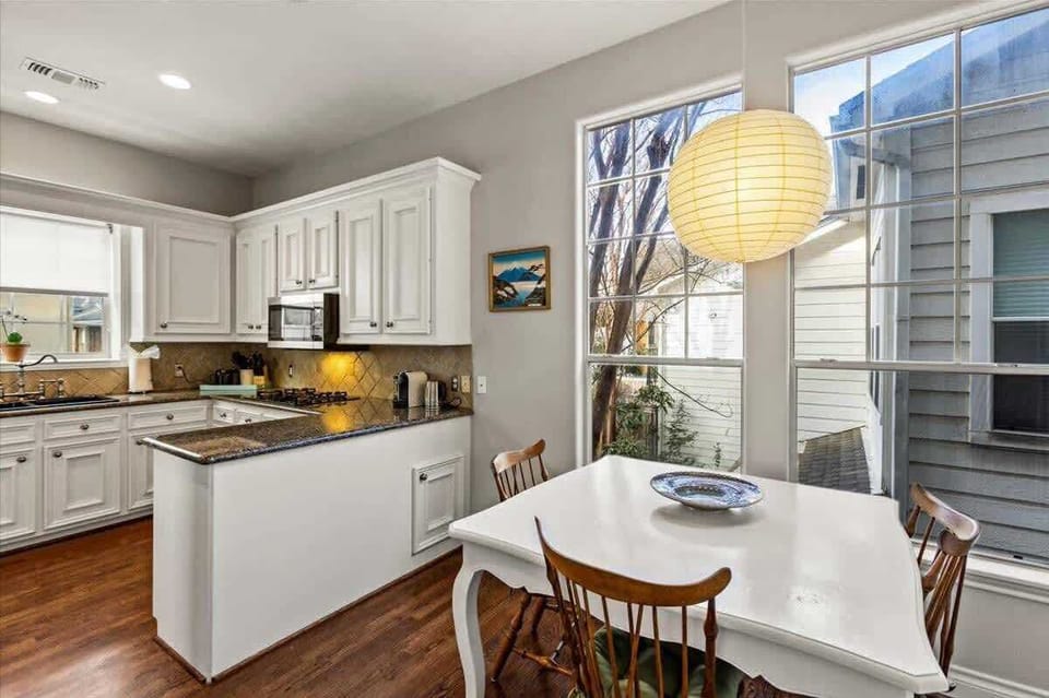 Kitchen equipped with all the basic amenities and kitchen table.
