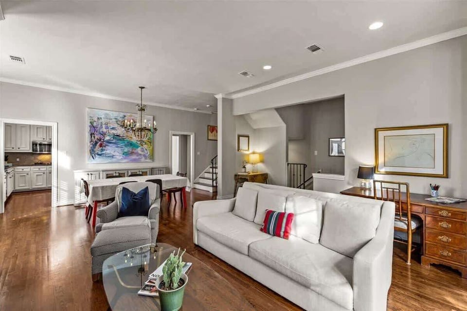 Living room with frame TV and fireplace. 