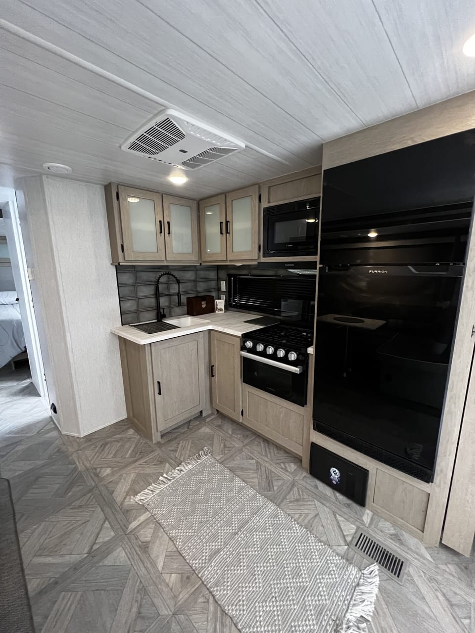 Full kitchen area with amenities
