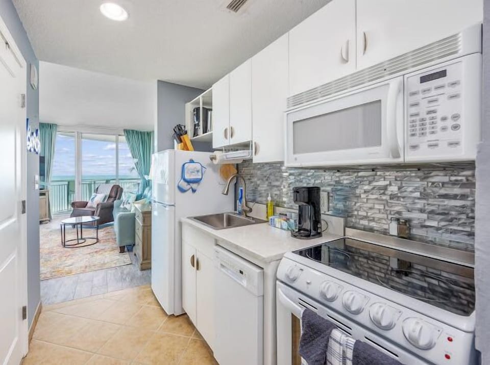 Fully stocked kitchen:  pots, pans, dishes, glasses, utensils, appliances