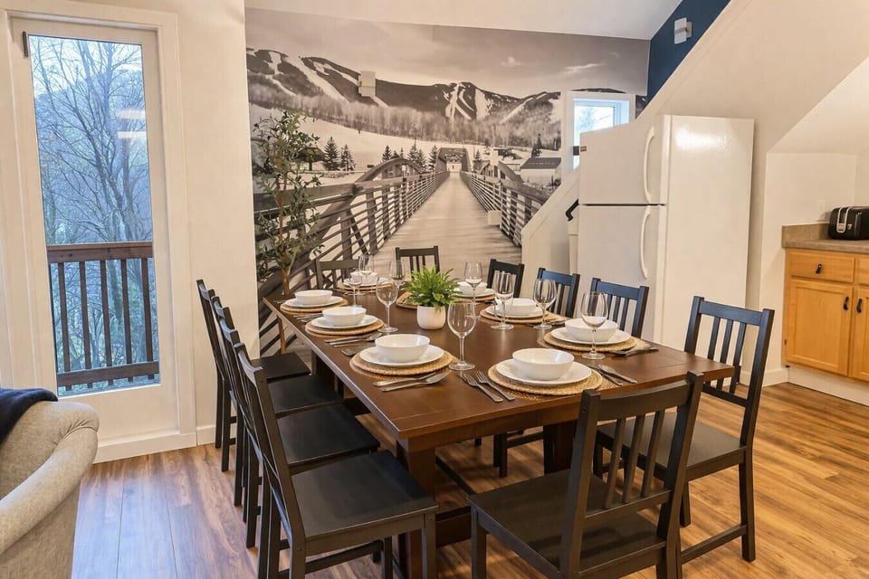 Dining area adorned with large Killington mountain wall decor.