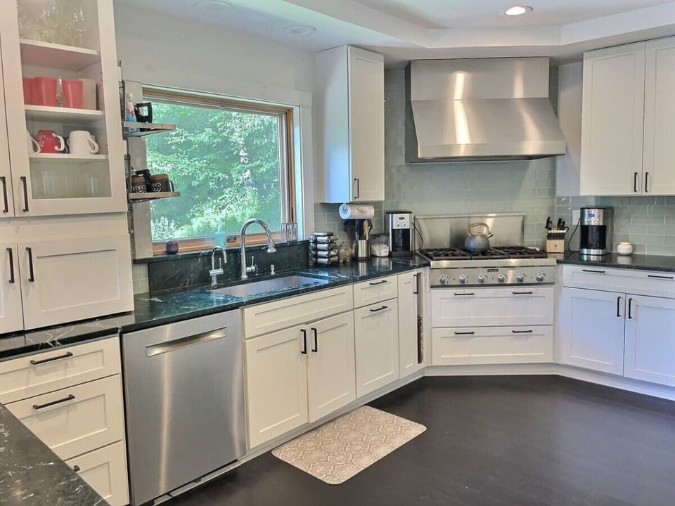 Experience the charm of our kitchen, where touches of white blend seamlessly with upgraded appliances, creating a cozy yet functional space for all your culinary adventures.