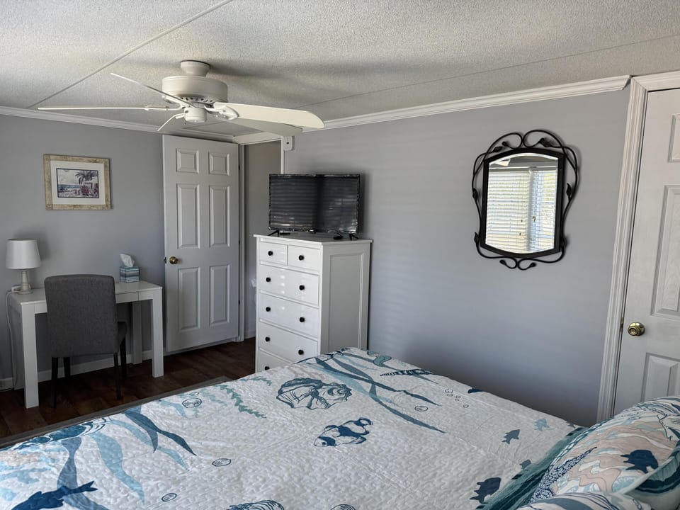 Cozy bedroom retreat with calming coastal decor and workspace