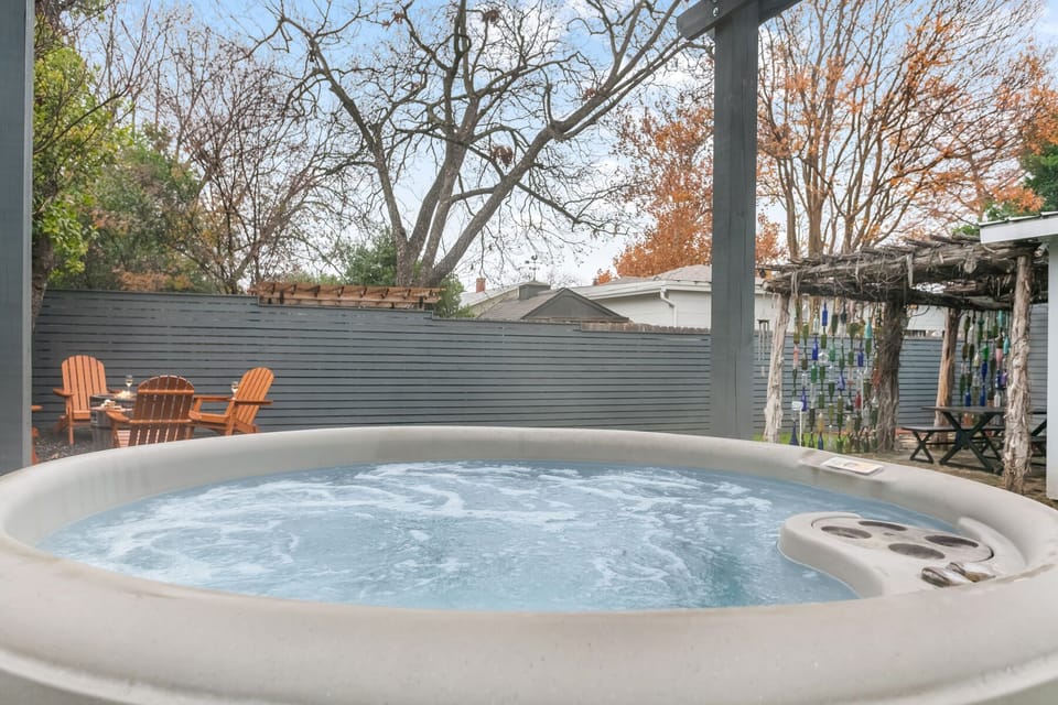 Enjoy a cozy evening soak in the backyard hot tub under the stars.